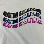 "Abortion Is Healthcare" Women's T-Shirt