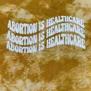 "Abortion Is Healthcare" Tie Dyed Unisex T-Shirt