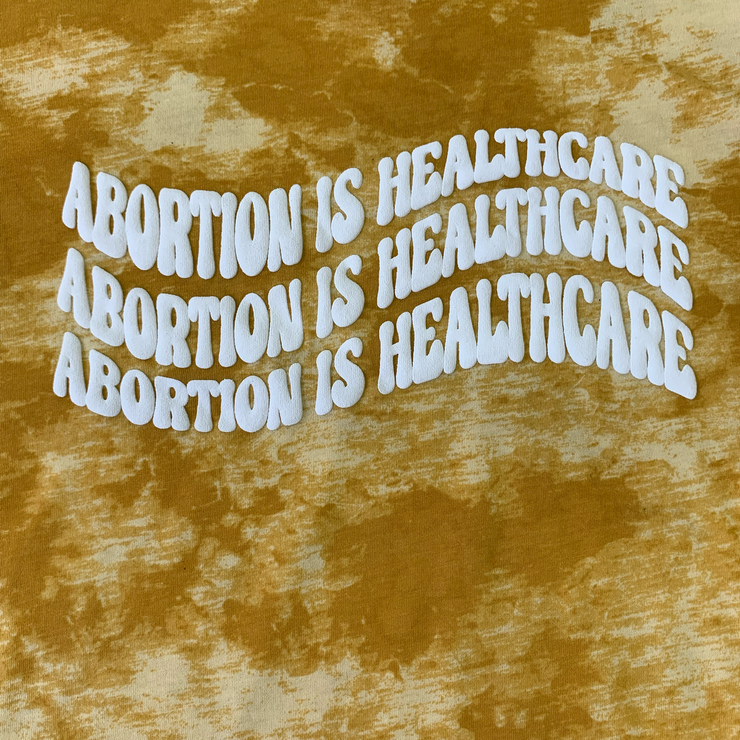 "Abortion Is Healthcare" Tie Dyed Unisex T-Shirt