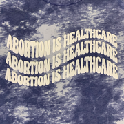 "Abortion Is Healthcare" Tie Dyed Unisex T-Shirt